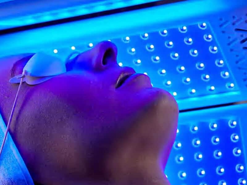 Person having light therapy treatment